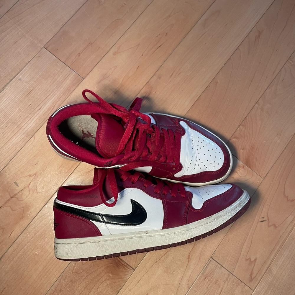burgundy and black Nike Air Jordan 1s
